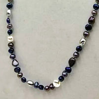 Multicolor freshwater cultured pearls on sky blue silk, rope necklace. 36" Length.