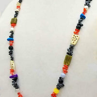 A wild & beautiful collage of gem stones, art glass, bone & more, hand-knotted with white silk. 36" Length.