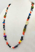 A wild & beautiful collage of gem stones, art glass, bone & more, hand-knotted with white silk. 36" Length.