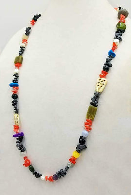 A wild & beautiful collage of gem stones, art glass, bone & more, hand-knotted with white silk. 36