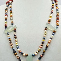 Sterling silver, multi-color freshwater & cultured pearl with coral & prehnite, hand-knotted with purple silk. 27" length.