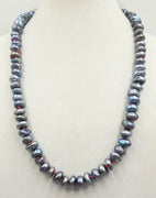 Massive, grey lavender peacock pearl rope hand-knotted with bright crimson silk. 27" length.