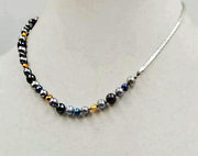 Sterling silver, multi-color fresh-water pearl necklace, hand-knotted with dove grey silk. Unisex style. 17.5" length.