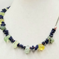 Blue aventurine & prehnite on hand-knotted bright crimson silk, with an adjustable sterling silver chain. An ideal unisex necklace that will get attention.