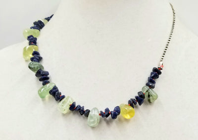 Blue aventurine & prehnite on hand-knotted bright crimson silk, with an adjustable sterling silver chain. An ideal unisex necklace that will get attention.