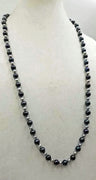 "Quiet elegance." Alternating cultured & fresh-water pearls, hand-knotted with sky blue silk, rope necklace. 33" length.