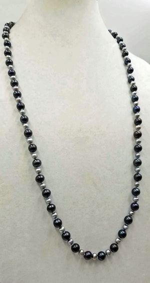 PRICEREDUCED "Quiet elegance." Alternating cultured & fresh-water pearls, hand-knotted with sky blue silk, rope necklace. 33" length.