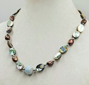 Sterling silver, abalone, bronze baroque pearls, with aquamarine focal necklace on hand-knotted sky blue silk. 21.25" length.
