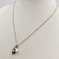 Sweet & classy. Adjustable, sterling silver & bi-tone pearls pendant necklace. 16" - 18" Length.