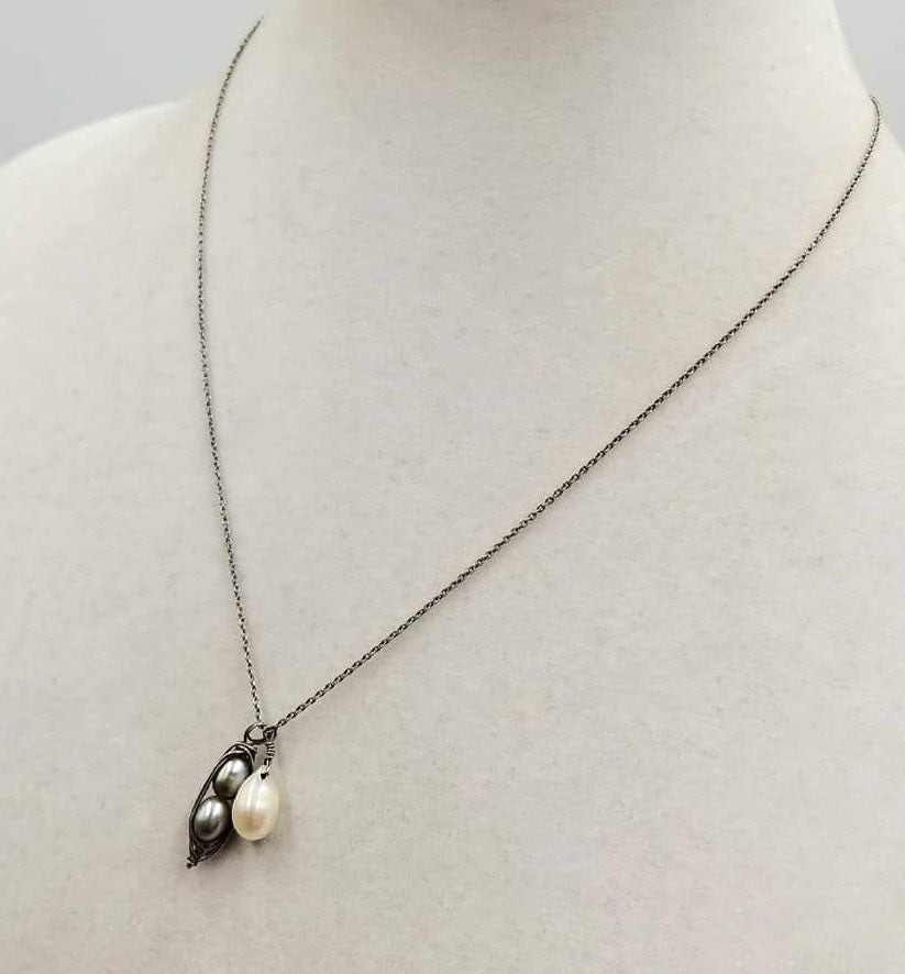 Sweet & classy. Adjustable, sterling silver & bi-tone pearls pendant necklace. 16" - 18" Length.