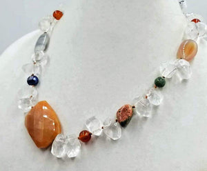 Unique. Unusual. Gorgeous. Wow! You don't have to be a royal to look like one with this necklace of varying stones on silk. 20.5" length.