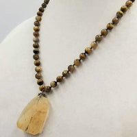 Past Work. Unisex. Sterling silver & tiger's eye necklace with art glass pendant on silk. 20" length. Sold.