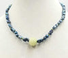 Unisex, Sterling silver, black baroque pearl & vintage carved nephrite jade focal necklace on moss green silk. 20" length.