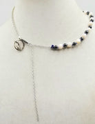 PRICE REDUCED Dolphins jumping for joy! Adjustable, Sterling silver, dyed shell & hematite dolphin necklace, hand-knotted with periwinkle silk. 16" to 22" length.