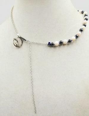 Dolphins jumping for joy! Adjustable, Sterling silver, dyed shell & hematite dolphin necklace, hand-knotted with periwinkle silk. 16" to 22" length.