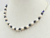 Dolphins jumping for joy! Adjustable, Sterling silver, dyed shell & hematite dolphin necklace, hand-knotted with periwinkle silk. 16" to 22" length.