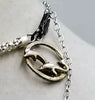 Dolphins jumping for joy! Adjustable, Sterling silver, dyed shell & hematite dolphin necklace, hand-knotted with periwinkle silk. 16" to 22" length.