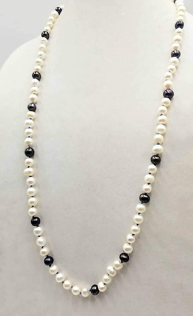 PRICE REDUCED! Classic & beautiful, yet modern.  Black & peacock pearl rope necklace hand-knotted with periwinkle silk. 35" length.