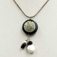 Simply beautiful. Sterling silver, onyx, & pearl pendant necklace. 16" length.