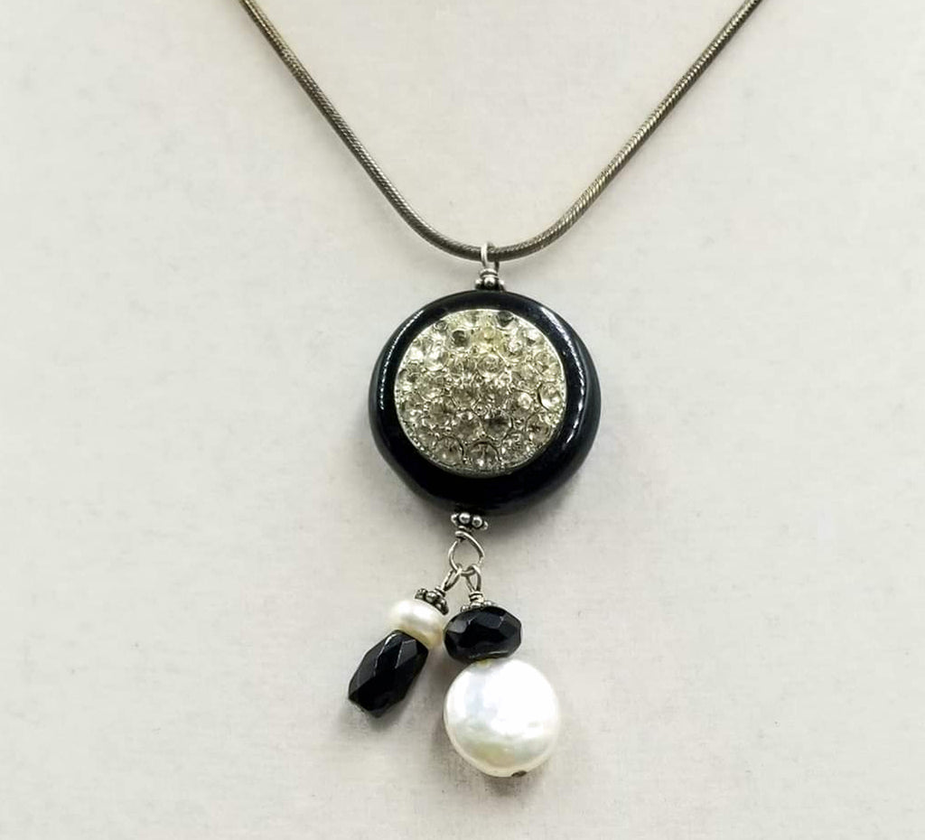 Simply beautiful. Sterling silver, onyx, & pearl pendant necklace. 16" length.