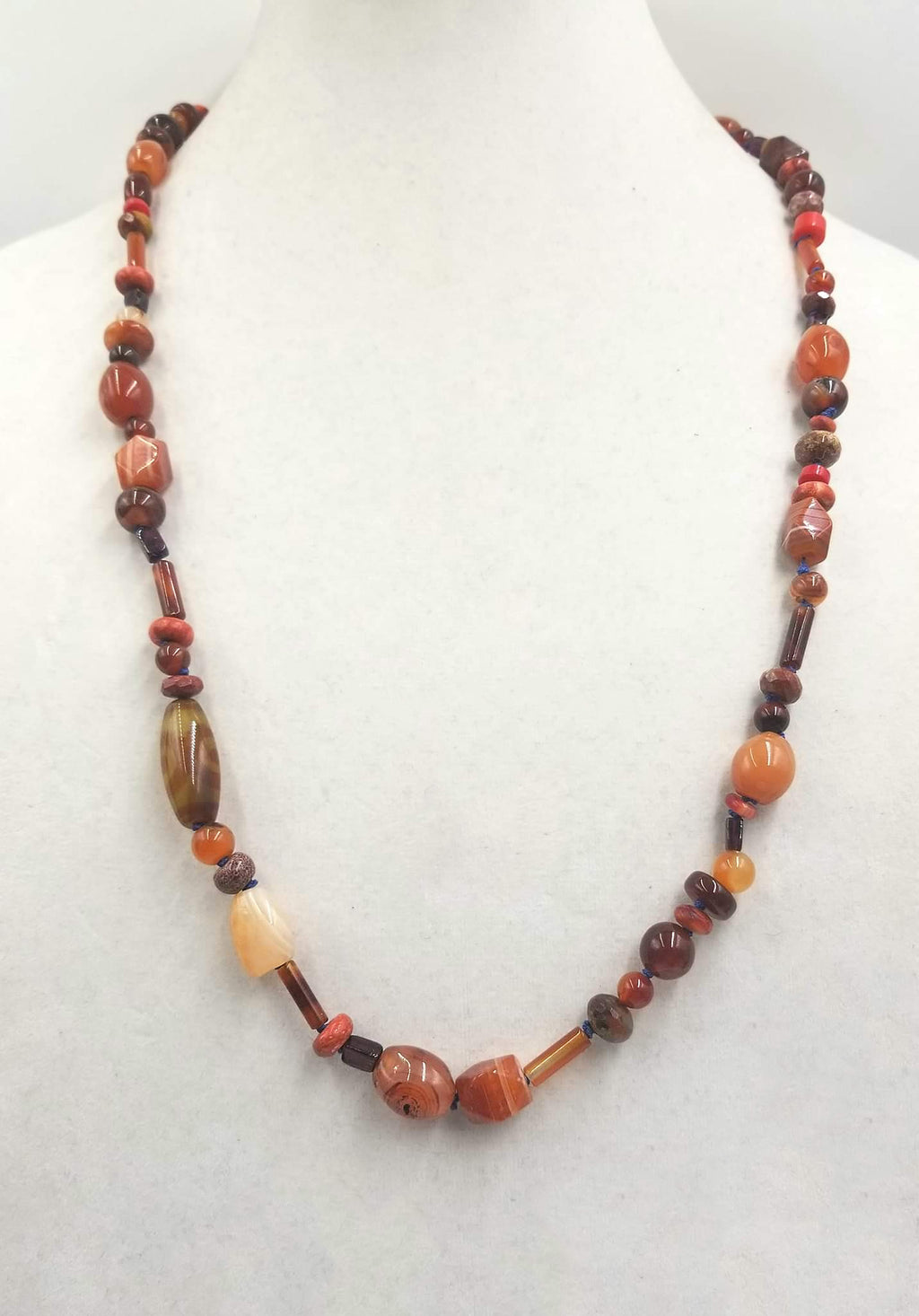 Agate, coral, tiger's eye, carnelian rope necklace, hand-knotted with periwinkle silk. 30" length.