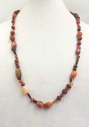 Agate, coral, tiger's eye, carnelian rope necklace, hand-knotted with periwinkle silk. 30" length.