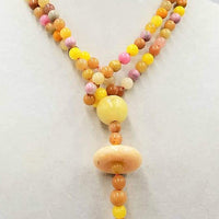 Unusual & gorgeous necklace. Precious yellow, peach, & orange jadeite, rhodonite, and dyed quartz necklace, hand-knotted with crimson silk.  39" with 4" focal.