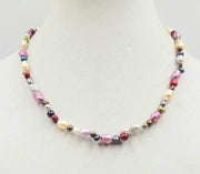 PRICE REDUCED Beautiful multi-colored pearls, 14KYG, necklace on white silk. 20" Matinee length.