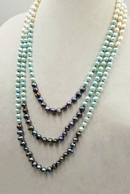 Classic or modern? New to our Aurora Borealis Collection. The black pearls are a knock-out, enhancing the white pearls.  22