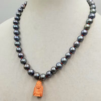 14K Yellow Gold,  peacock pearl & carved coral buddha pendant necklace, hand-knotted with crimson silk. 19.25 inch length.