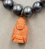 14K Yellow Gold,  peacock pearl & carved coral buddha pendant necklace, hand-knotted with crimson silk. 19.25 inch length.