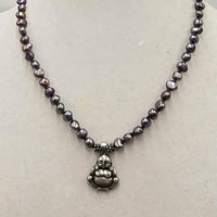 PRICE REDUCED Sterling silver buddha,  freshwater peacock pearl necklace, on hand-knotted forest green silk. 18.5in length.