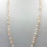 Stunning & Classic. Beige, pink, & white pearl rope necklace, crimson silk. 32" length.