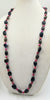Rocking 80s Smokey quartz, magenta dyed jasper and Black onyx rope on golden silk.  39" length.