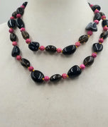 Rocking 80s Smokey quartz, magenta dyed jasper and Black onyx rope on golden silk.  39" length.