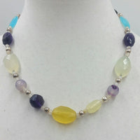 Sterling silver, amethyst, amazonite, onyx, agate, moonstone, hand-knotted white silk. 19.5" Length.