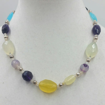 Sterling silver, amethyst, amazonite, onyx, agate, moonstone, hand-knotted white silk. 19.5