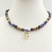 Multicolor pearl & 14KYG atomic pendant necklace on periwinkle silk.